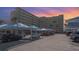 Exterior view of Harbor View building featuring covered parking and vibrant sunset in Indian Rocks Beach, Florida at 145 N Halifax Ave # 601, Daytona Beach, FL 32118