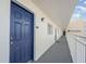 Exterior hallway to condo unit 601 with blue door in Harbor View building in Indian Rocks Beach, Florida at 145 N Halifax Ave # 601, Daytona Beach, FL 32118