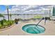 Inviting hot tub overlooking the bay, complemented by chaise lounges and lush tropical landscaping at 145 N Halifax Ave # 601, Daytona Beach, FL 32118