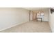 Spacious living room with large window, tv mount, and tile flooring in Harbor View condo at 145 N Halifax Ave # 601, Daytona Beach, FL 32118