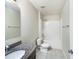 Bathroom featuring a granite vanity top, a combined shower-bathtub, toilet, and tiled flooring at 15120 Zenith Ave, Mascotte, FL 34753