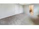 View of the bedroom showing its neutral tones and two closets, leading into a connected bathroom at 15120 Zenith Ave, Mascotte, FL 34753