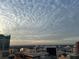 Stunning city view under a textured cloudscape from a high-rise building at 155 S Court Ave # 2106, Orlando, FL 32801