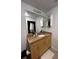 Bathroom featuring a granite vanity and ample storage at 155 S Court Ave # 2106, Orlando, FL 32801