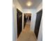 Hallway with access to closet space that is designed for organized storage at 155 S Court Ave # 2106, Orlando, FL 32801