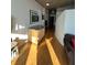 Inviting hallway with hardwood floors, stylish decor, and natural light at 155 S Court Ave # 2106, Orlando, FL 32801
