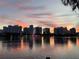 A stunning lake view reflects a colorful sunset and the city skyline at 155 S Court Ave # 2106, Orlando, FL 32801