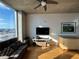 Cozy living room with sleek hardwood floors, modern furniture and a city view at 155 S Court Ave # 2106, Orlando, FL 32801