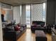 Comfortable living room with stylish decor, modern seating, and abundant natural light at 155 S Court Ave # 2106, Orlando, FL 32801