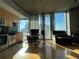 Bright living space with modern kitchen, hardwood floors, and expansive city views at 155 S Court Ave # 2106, Orlando, FL 32801