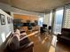 Open living space with modern kitchen, hardwood floors and an expansive cityscape view at 155 S Court Ave # 2106, Orlando, FL 32801
