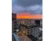 Breathtaking sunset view of the city skyline from a rooftop terrace at 155 S Court Ave # 2106, Orlando, FL 32801