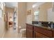 This bathroom has a single sink vanity with a granite countertop, a toilet and a shower at 15993 Johns Lake Overlook Dr, Winter Garden, FL 34787