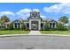 Welcoming community entrance featuring a walkway with manicured landscaping at 15993 Johns Lake Overlook Dr, Winter Garden, FL 34787