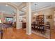 Open-concept dining room area featuring hardwood floors and elegant chandelier lighting at 15993 Johns Lake Overlook Dr, Winter Garden, FL 34787