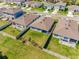 Aerial view of the home's backyard, with the fenced yard and patio areas perfect for outdoor living at 1671 Spray Ter, St Cloud, FL 34771