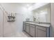 Bathroom featuring double vanity with granite countertops and modern fixtures at 1671 Spray Ter, St Cloud, FL 34771