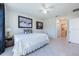 Well-lit bedroom featuring neutral paint, modern artwork, and a ceiling fan at 1671 Spray Ter, St Cloud, FL 34771