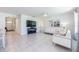 Open living space with tile floors, modern decor, and seamless flow to the kitchen at 1671 Spray Ter, St Cloud, FL 34771