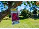 Outdoor scenery featuring a bougainvillea plant, set against a backdrop of lush greenery at 1671 Spray Ter, St Cloud, FL 34771