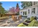 A backyard patio with wooden table and chairs, and plenty of space for outdoor dining at 1750 Winchester Dr, Winter Park, FL 32789