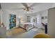 Cozy bedroom with a ceiling fan, and colorful built-in shelving at 1750 Winchester Dr, Winter Park, FL 32789