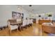 Elegant dining room with a wooden table, upholstered chairs, wine racks, and stylish light fixtures at 1750 Winchester Dr, Winter Park, FL 32789