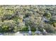 Aerial view of property with mature trees, lush landscaping, and a private pool at 2614 W Ponkan Rd, Apopka, FL 32712