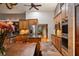 Bright kitchen featuring stainless steel appliances, granite counters, and a view into the dining area at 2614 W Ponkan Rd, Apopka, FL 32712