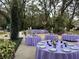 Outdoor dining with beautifully decorated tables and elegant lavender linens at 2614 W Ponkan Rd, Apopka, FL 32712