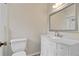 Bathroom featuring white vanity with marble top, decorative mirror and shower/tub combination at 2643 Nova Dr, Apopka, FL 32703