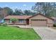 Charming single-story home featuring a two-car garage, well-manicured lawn and tasteful landscaping at 2643 Nova Dr, Apopka, FL 32703