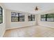 Living room showcasing tile flooring and three large windows at 2643 Nova Dr, Apopka, FL 32703