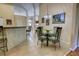 Cozy dining area features a glass table, seating for four, and natural light, creating an inviting space at 304 Silver Pine Dr, Lake Mary, FL 32746