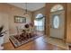 Elegant dining room with a table set for six, a decorative rug, and ample natural light from a large window at 304 Silver Pine Dr, Lake Mary, FL 32746