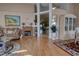 Inviting living room with high ceilings, wood floors, fireplace, and decorative accents, creating a cozy atmosphere at 304 Silver Pine Dr, Lake Mary, FL 32746