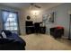 Inviting living room features a comfortable daybed, modern ceiling fan, and natural light from the bright window at 304 Silver Pine Dr, Lake Mary, FL 32746