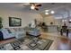 Spacious living room showcasing seamless flow to the kitchen and dining area, perfect for entertaining at 304 Silver Pine Dr, Lake Mary, FL 32746