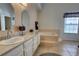 Bright bathroom featuring one sink and large soaking tub at 304 Silver Pine Dr, Lake Mary, FL 32746