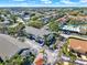 Beautiful aerial view of the community featuring manicured landscaping, a pool, and tennis court at 3206 Sabal Palms Ct # A, Kissimmee, FL 34747