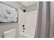 Clean bathroom with a shower, featuring a white shower and dark fixtures at 3206 Sabal Palms Ct # A, Kissimmee, FL 34747