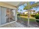 Enjoy this tiled patio with a screened enclosure and sliding door leading to the bedroom at 3206 Sabal Palms Ct # A, Kissimmee, FL 34747