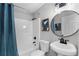 This bathroom features a shower and tub, toilet, sink, and round mirror at 3208 Sabal Palms Ct # A, Kissimmee, FL 34747