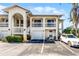 Charming two-story condo with private balconies, a one-car garage, and reserved parking spaces for residents at 3208 Sabal Palms Ct # A, Kissimmee, FL 34747