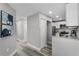 Hallway view of kitchen with stainless steel appliances and granite countertops at 3208 Sabal Palms Ct # A, Kissimmee, FL 34747