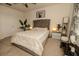 Cozy main bedroom with a comfortable bed, soft carpet, and ample natural light creating a peaceful retreat at 3332 Logan Berry Dr, Mount Dora, FL 32757