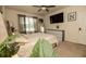 Relaxing main bedroom featuring a neutral palette, large window, and modern furnishings, offering a peaceful sanctuary at 3332 Logan Berry Dr, Mount Dora, FL 32757