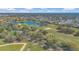 Aerial view of golf course and surrounding neighborhood at 340 Grand Canal Dr, Poinciana, FL 34759