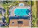 Aerial view of a swimming pool and surrounding deck with lounge chairs and landscaping at 340 Grand Canal Dr, Poinciana, FL 34759