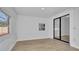 Bedroom with white walls, light wood floors, and sliding glass doors at 3627 Arch St, Orlando, FL 32808